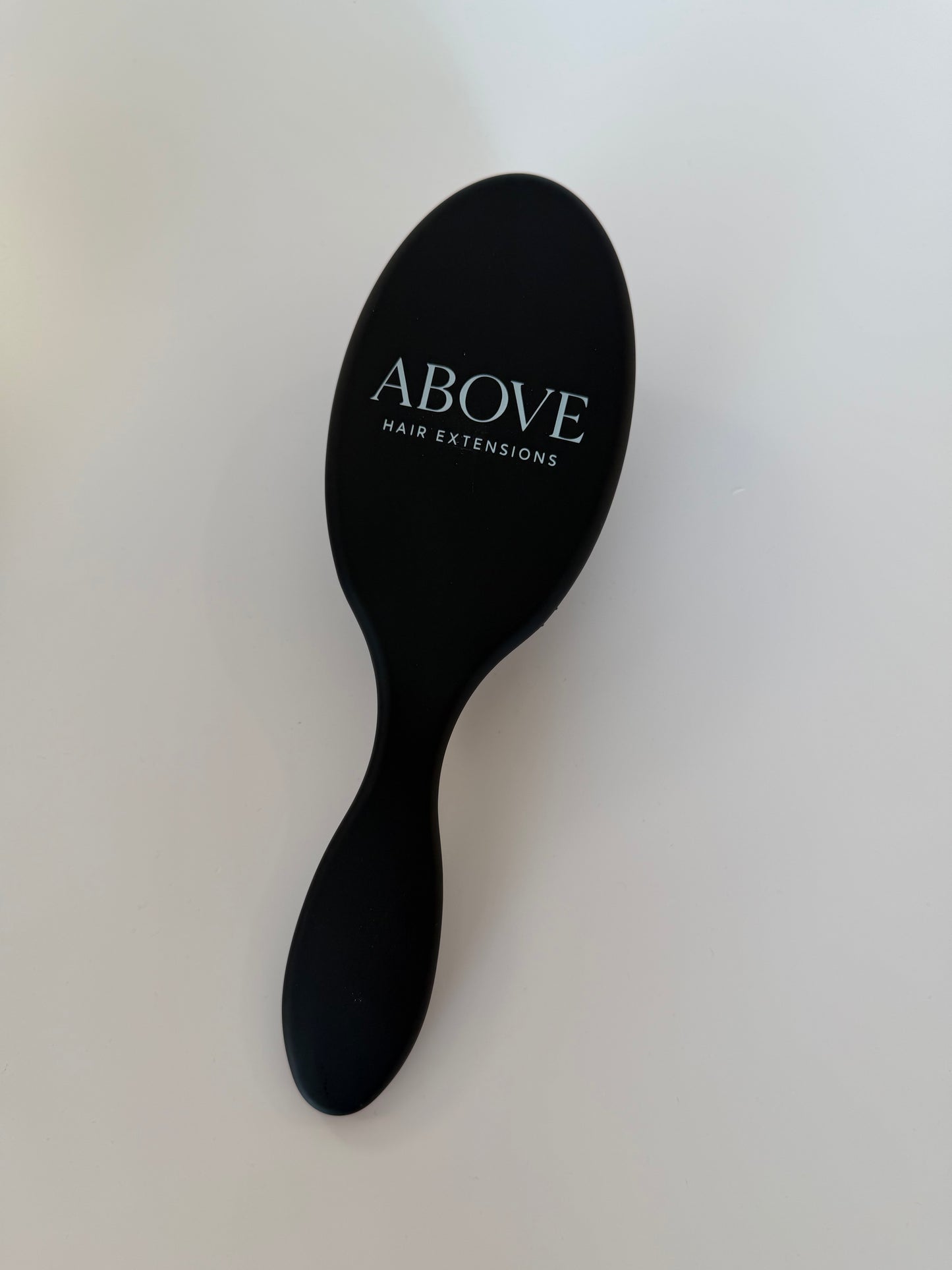 ABOVE HAIR BRUSH